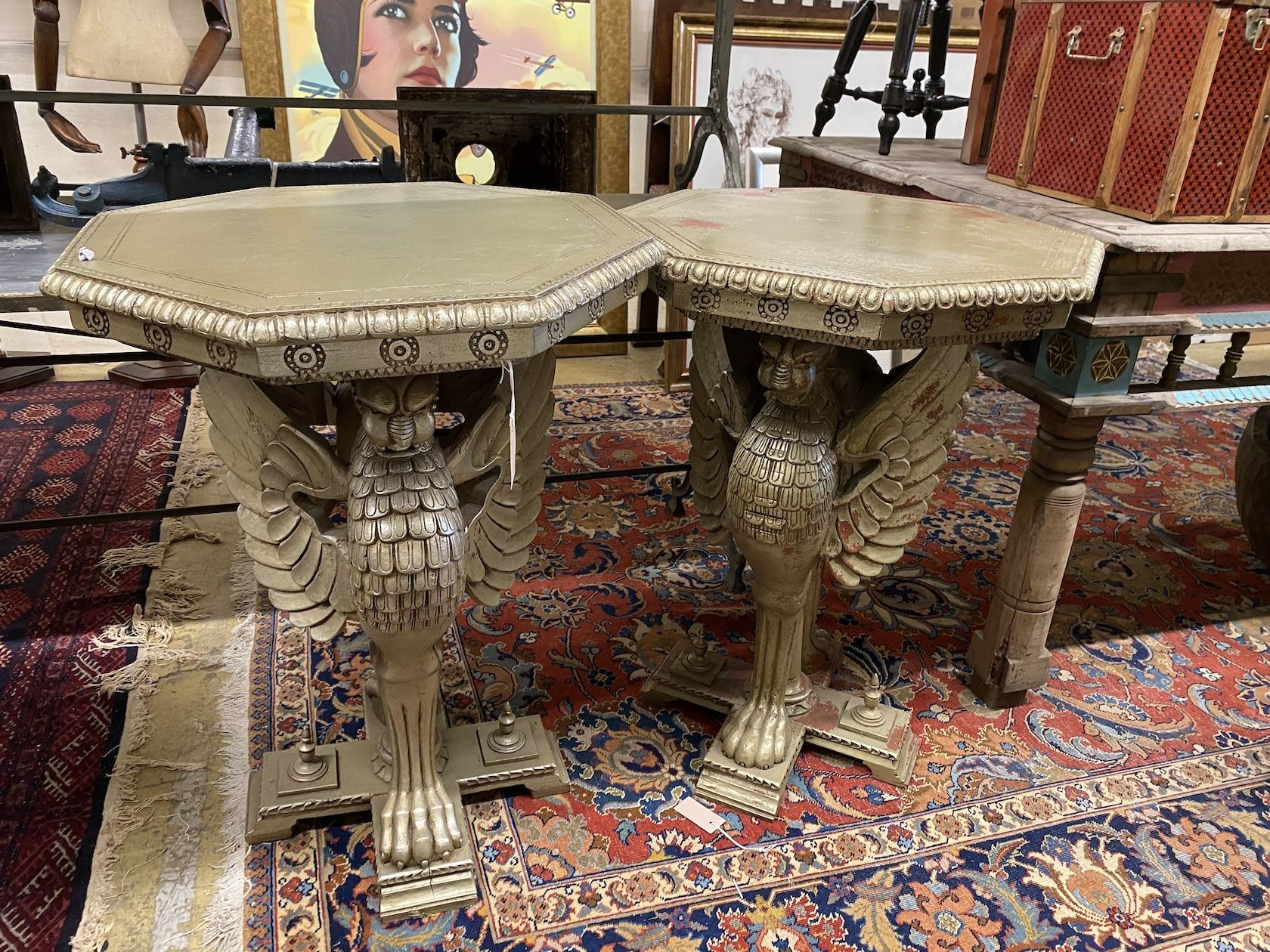 A pair of Empire style octagonal wooden centre tables with winged griffin supports, width 60cm, height 82cm